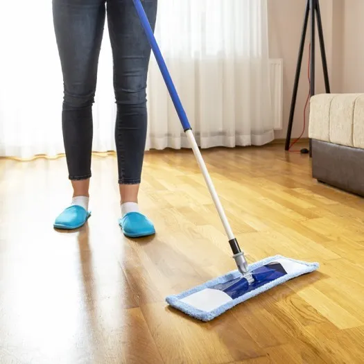 Lady cleaning vinyl floor | Kellum's Floors and More